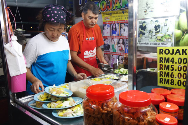 Hawker sells rojak on the road side in Penang