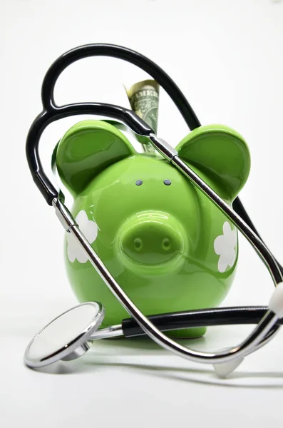 Piggy bank and stethoscope — Stock Photo, Image