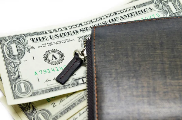 Money sticking out of a leather wallet — Stock Photo, Image