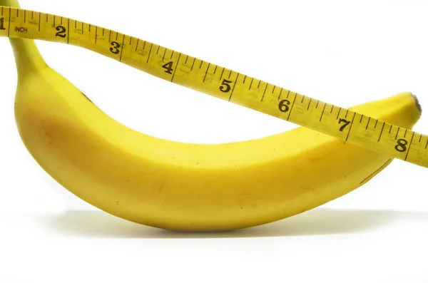 Banana with tape measure — Stock Photo, Image