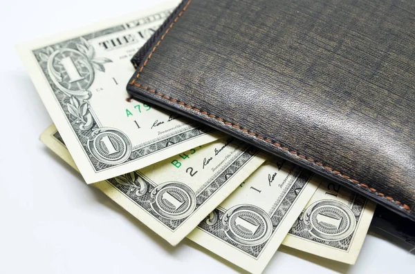 Money sticking out of a leather wallet — Stock Photo, Image