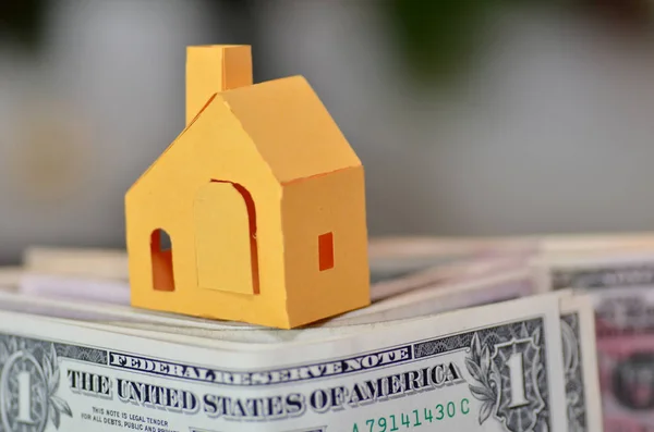 Miniature paper made house stand on  money — Stock Photo, Image
