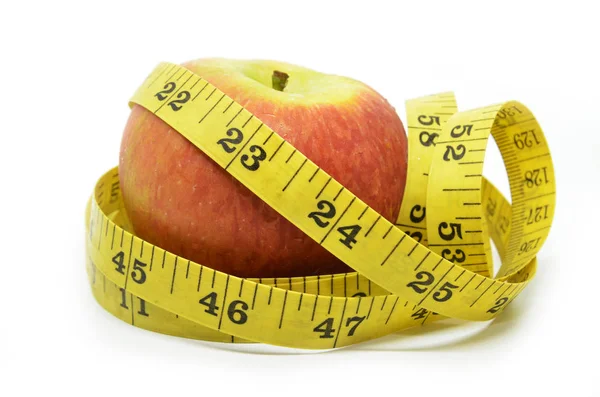 Apple and measuring tape Royalty Free Stock Photos
