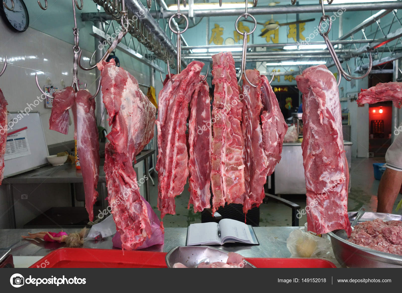 Meat hanging at local wet market in Penang, Malaysia ...