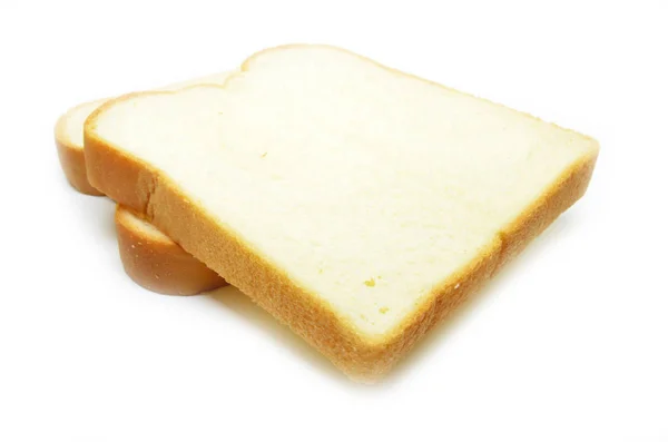 Pão fatiado isolado no fundo branco — Fotografia de Stock