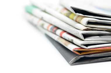 Newspapers folded and stacked clipart