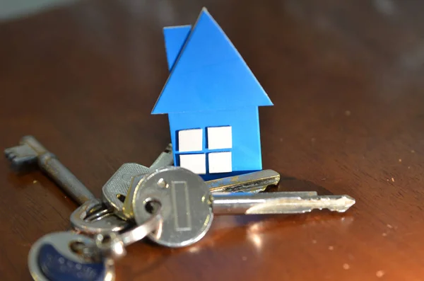 Bunch of keys with house shaped cardboard