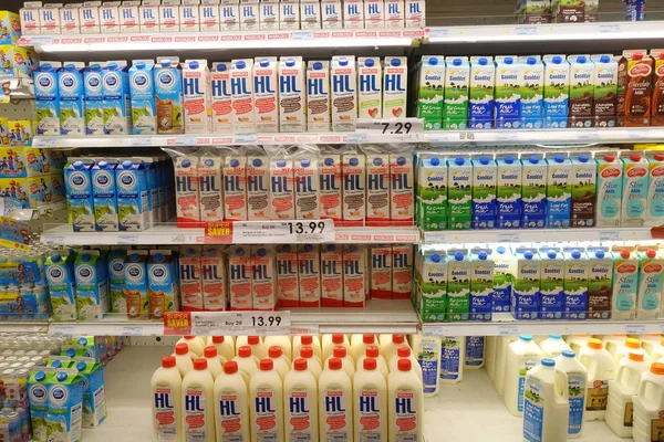 Selection of yogurts soy milk and milk on the shelves — Stock Photo, Image