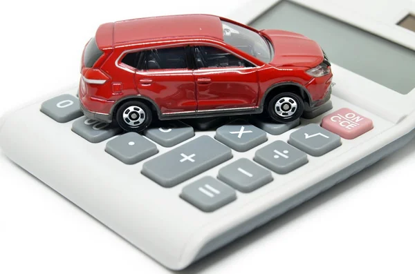 Calculator and toy car — Stock Photo, Image