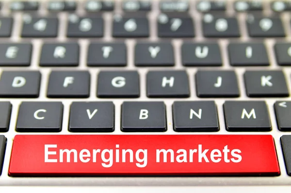 Emerging markets word on computer space bar — Stock Photo, Image