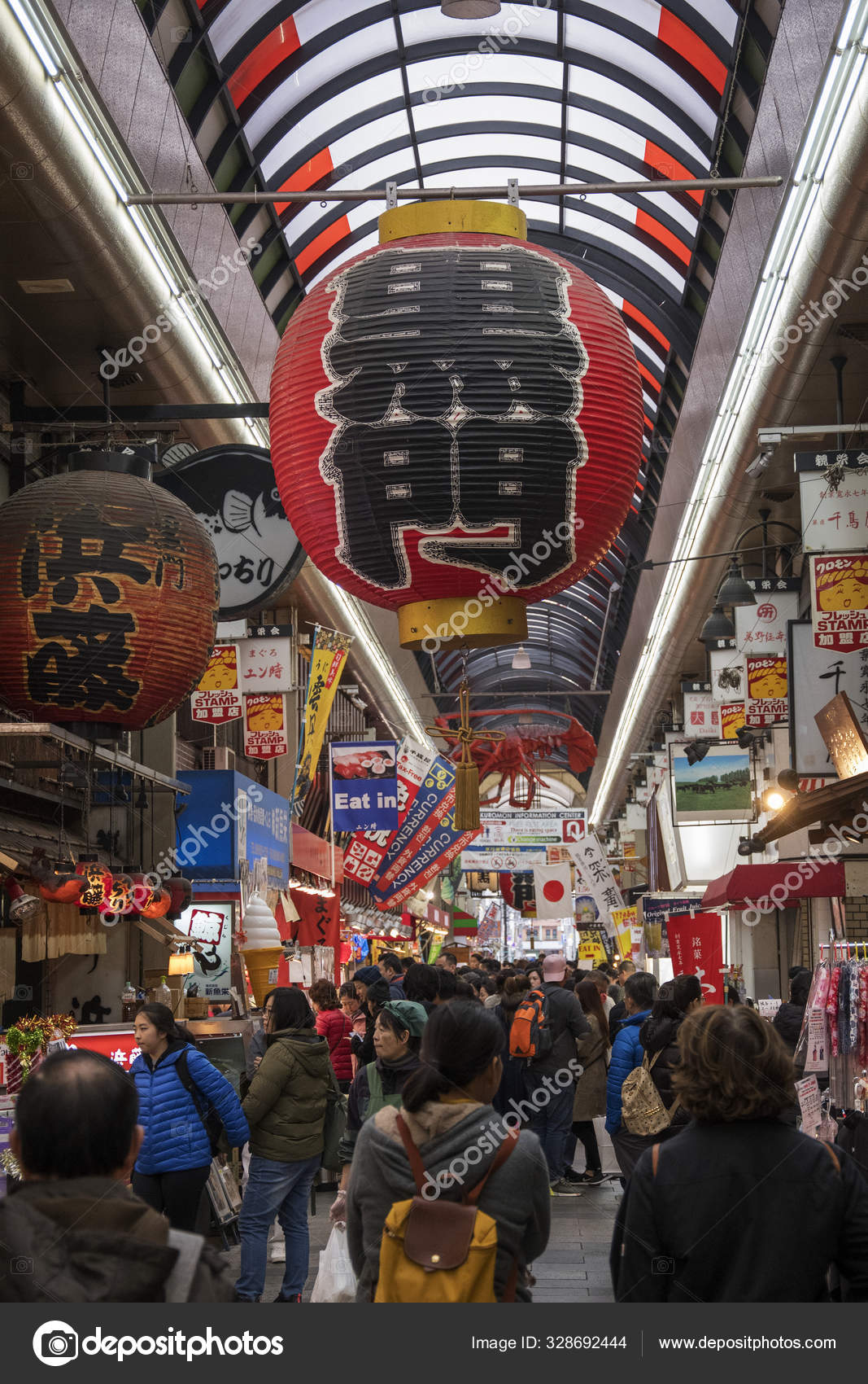 Shoppers Visit Nipponbashi Kuromon Ichiba Market In Osaka Japan Stock shoppers-visit-nipponbashi-kuromon-ichiba-market-in-osaka-japan-stock