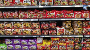 Various brand of instant noodles in packaging for sale clipart