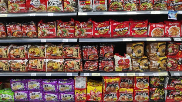 Various brand of instant noodles in packaging for sale — Stock Photo, Image