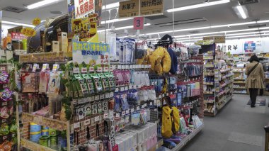 People shop in the convenience shop in the Kansai Airport, Osaka