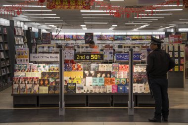 Book store shelves with rows of various books 