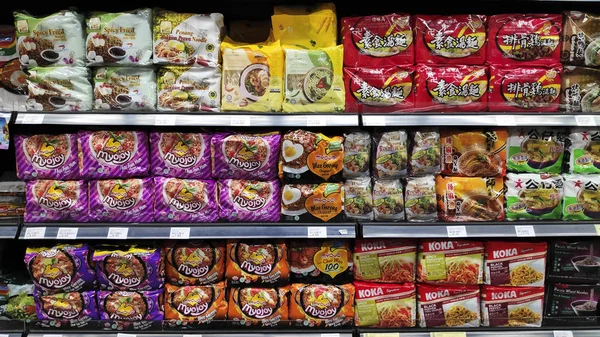 Various brand of instant noodles in packaging for sale — Stock Photo, Image