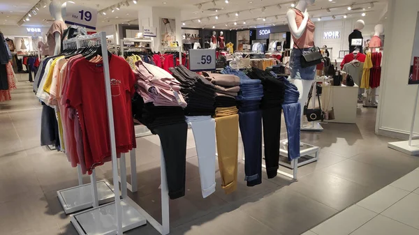 Fashion clothes display in department store — Stok fotoğraf