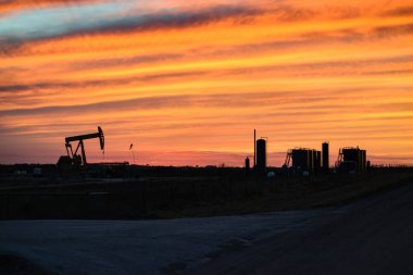 American Oil Field at Sunset clipart
