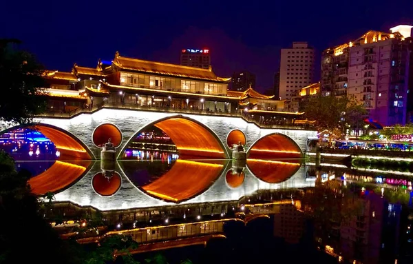 Beautiful bridge in China over a river with great light relfection