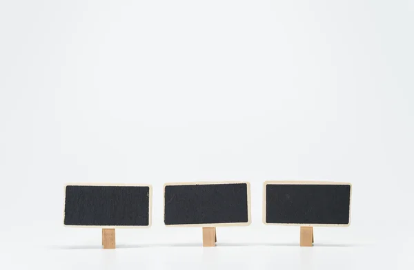 Three small black board with white background and selective focus — Stock Photo, Image