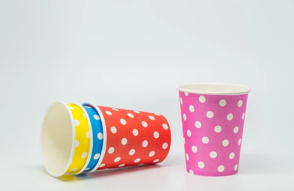 Stack of Colorful paper cup on white background and selective focus — Stockfoto