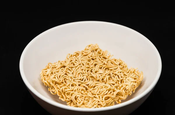 Isolated Instant Noodles in White ceramic bowl on Black background with clipping path — Stock Photo, Image