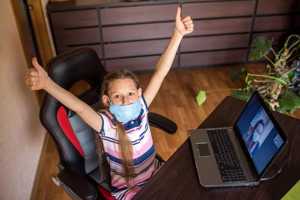 young woman with laptop. little girl with laptop. young woman holding blank sign. Coronavirus. Woman with face mask on quarantine. Stay at home.