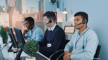 Customer support agent drinks tea and is bored.