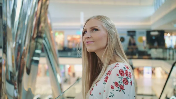 Amazed woman in shopping center.