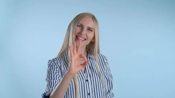 Attractive blonde woman making okay hand sign — Stock Photo, Image