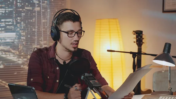 Radio news anchorman working in the evening in home studio — Φωτογραφία Αρχείου