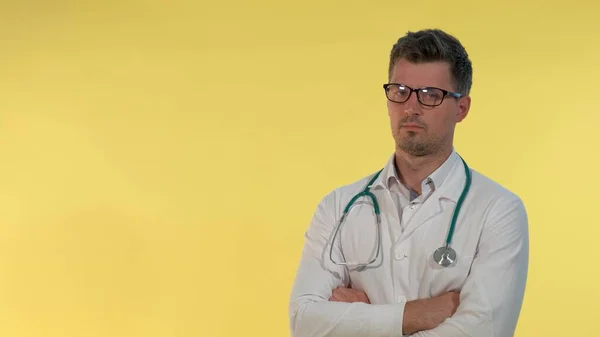 Portrait of young doctor in lab coat denying something to the camera — Stock Photo, Image