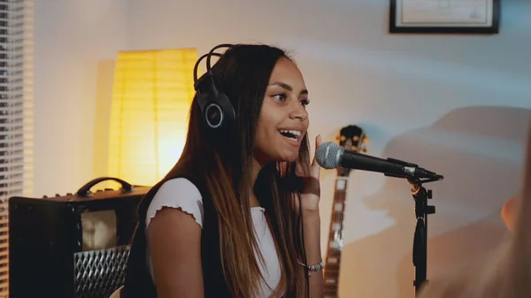 Black female vocalist in headphone recording her new song in home studio — Stock Photo, Image