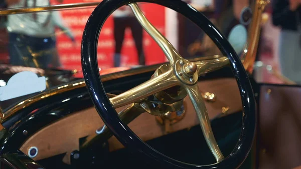 Black-golden steering wheel of retro car — Stock Photo, Image