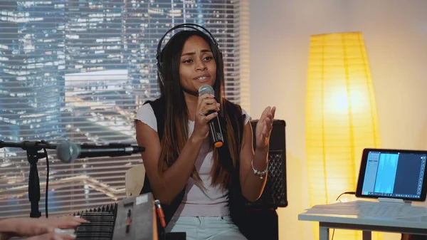 Home recording studio: multiracial pretty vocalist singing song into microphone — Stock Photo, Image