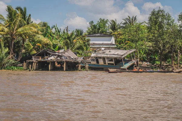 Destroyed house on the river bank