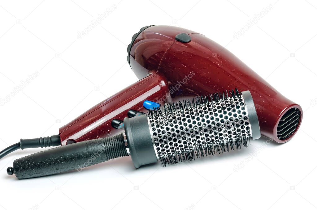 Hair dryer and hairbrush isolated on white background.