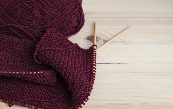Woolen burgundy yarn knitting — Stock Photo, Image