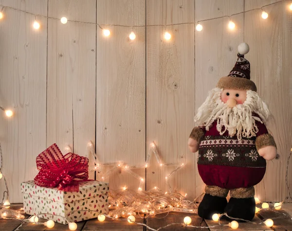 Santa claus, gift boxes and lights — Stock Photo, Image