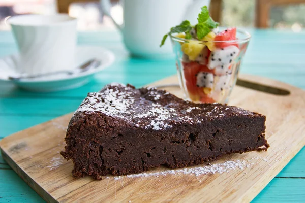 Chocolate cake with fruits salad — Stock Photo, Image