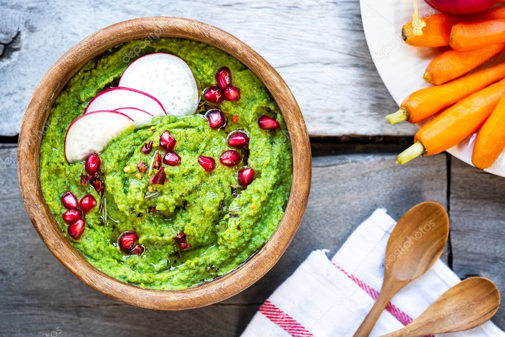 Spinach Hummus with Pomegranate and Herbs oil topping 