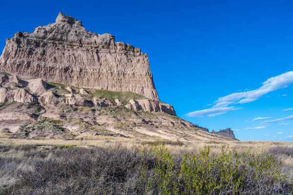 A natural rock formation of rugged badlands and towering bluffs