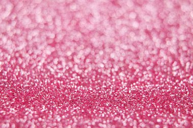 Pembe glitter arka plan. Seçici odak.