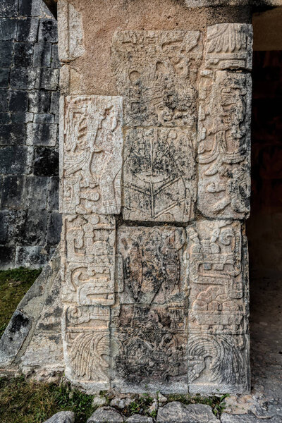 Carved pillar at the entrance into the Temple of the Jaguars 
