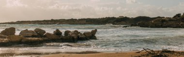 panoramic shot of rocks near mediterranean sea  clipart