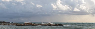panoramic shot of mediterranean sea against sky with clouds  clipart