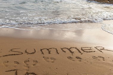 beach with summer lettering on sand near sea  clipart