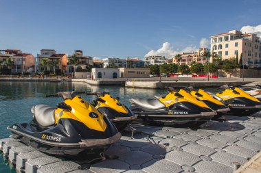 PAPHOS, CYPRUS - MARCH 31, 2020: modern jet skis near sea in harbor clipart