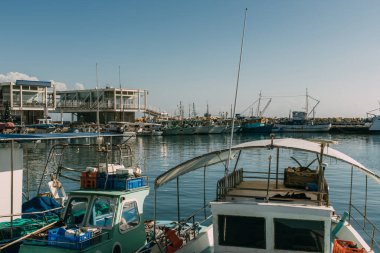 sunshine on docked ships in mediterranean sea clipart