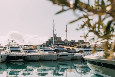 selective focus of docked yachts in mediterranean sea clipart